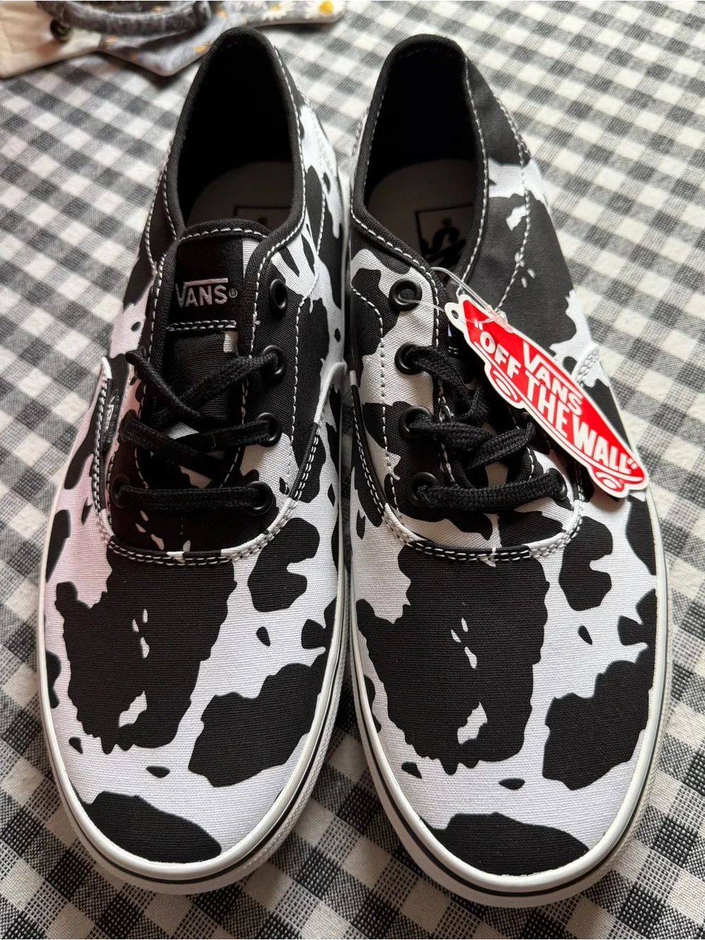 Vans Women’s Cow Print Slip-Ons